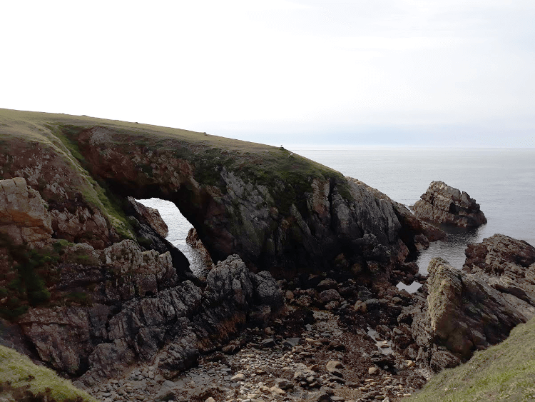 A rocky arch above the sea