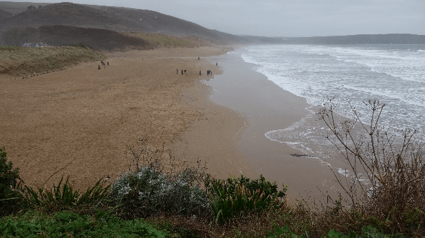 The yellow sands of Barricane Beach mark the final stretch of Gosia's walk.