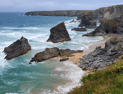 Rocky stacks protrude from the sea on the South West Coast Path, England's longest challenge hike.