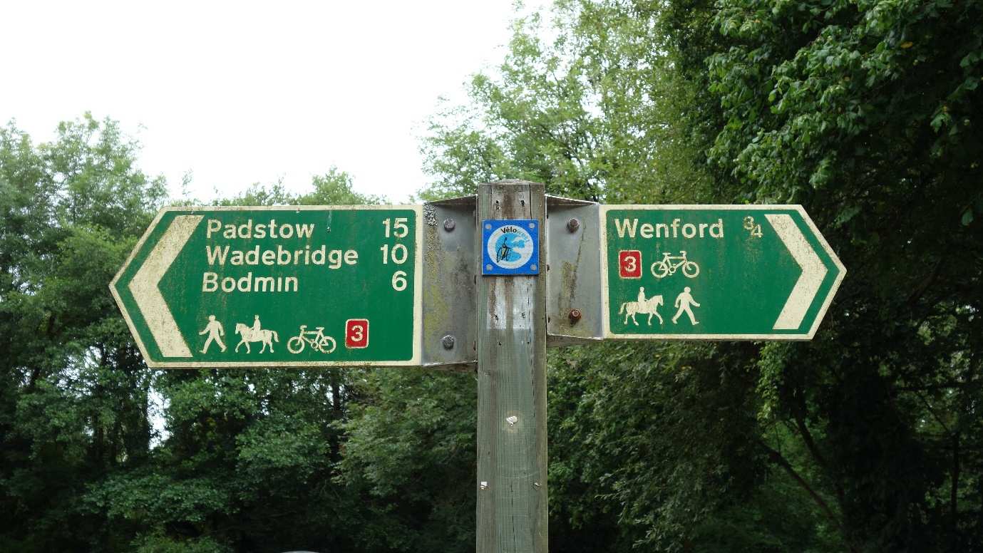 A wooden footpath signpost on the Camel Way