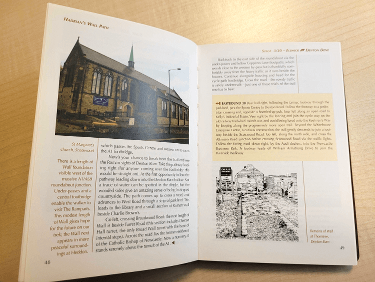 Cicerone guidebook open to a page about a local church, explaining its history.