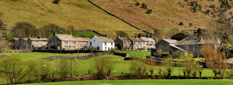 Buckden, one of the many villages in the Yorkshire Dales, sits beneath a steep green slope on the Dales Way.