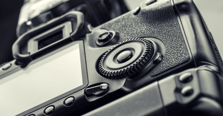 A close-up photo of a DSLR camera.