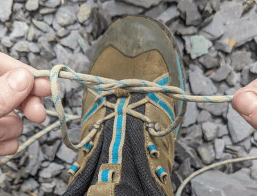 A useful lacing trick for hiking boots: the double starting knot. This is the same as the starting knot, but the laces wrap around one another an extra time.
