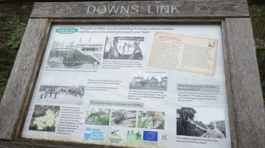 An information board explains the Downs Link's history as a railway line.