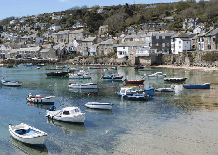 Boats moored near the trail on the Far West of Cornwall walking holiday