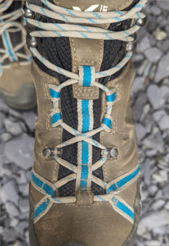 A walking boot with gap lacing fully secured.