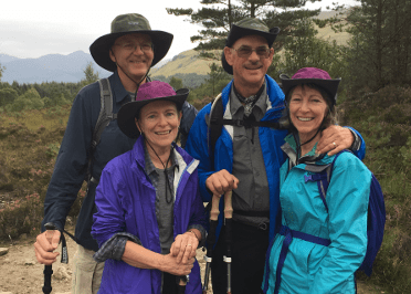 A group of walkers smile for the camera in their full walking clobber.