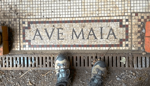 Walking boots at the ready at the start of Hadrian's Wall Path, standing on the famous Ave Maia mosaic.