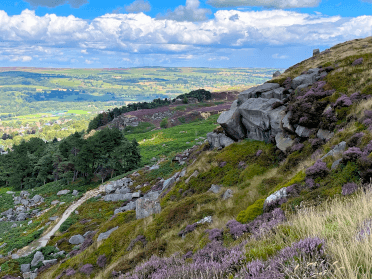 Rocky crags stand from the trail on the Dales Way