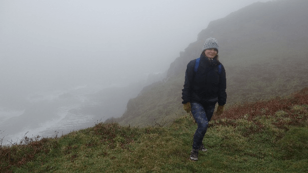 Gosia enjoys the first leg of her hike along the South West Coast Path to Woolacombe despite grey weather.