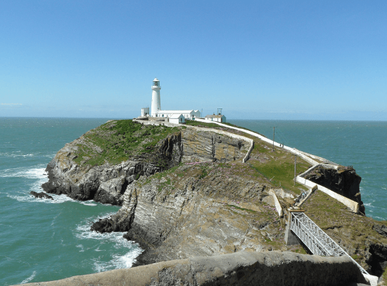 South Stack Lighthouse jutting into the sea on the Isle of Anglesey Coast Path