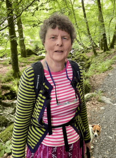 Karen and her Jack Russell, Mindy, take a walk in woodland.