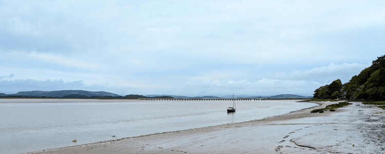 Views across the muddy flats and flat waters of the Kent Estuary on the Lancashire Coast Path.