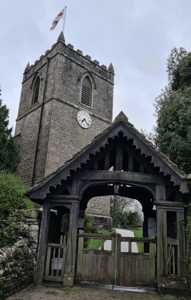 A view of the big square tower of St Mary's Church at Kettlewell on the Three Dales Way.