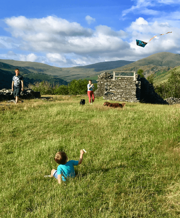 Flying a kite with the dogs.