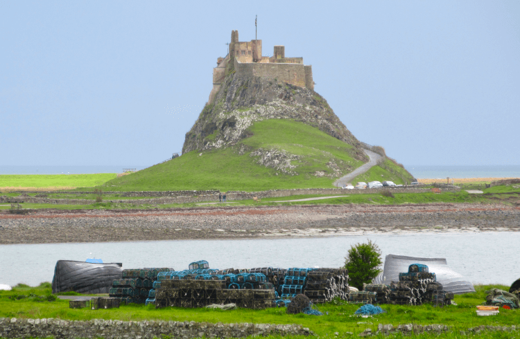 Views across the water to Lindisfarne, also known as the Holy Island of Northumberland. It's a rocky outcropping of an island, crowned with a castle cut into the stone.