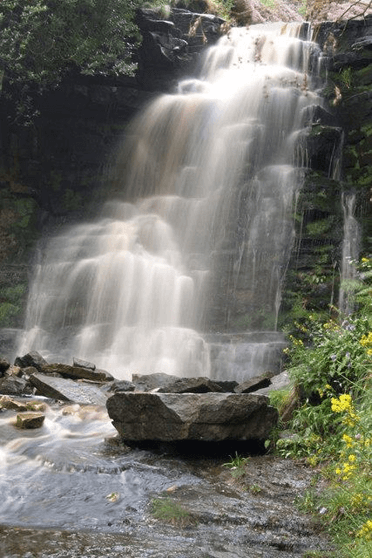 Middle Black Clough by Steve Fareham. This waterfall cascades over stepped stones into a central pool.