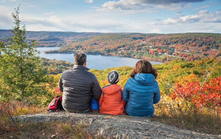 Parents and child taking a break on a walk in the Lake District