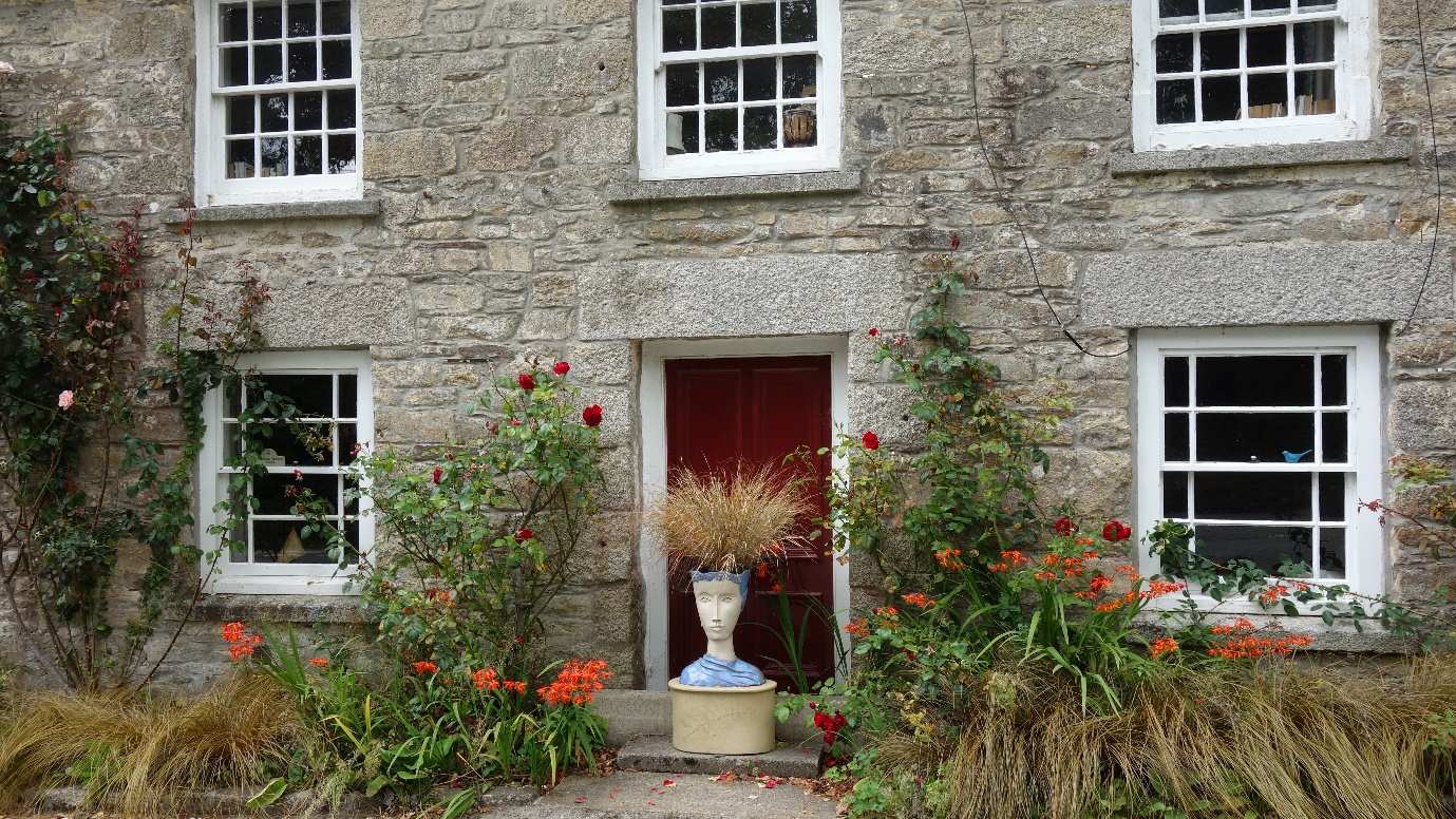 A plant pot in the shape of a human head