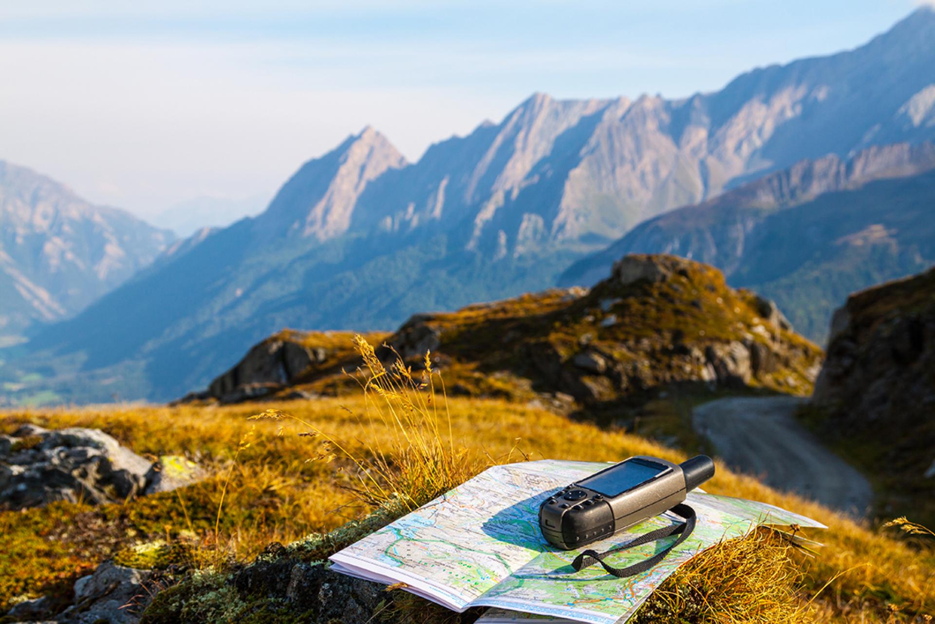 GPS device and map out in nature on a walking holiday