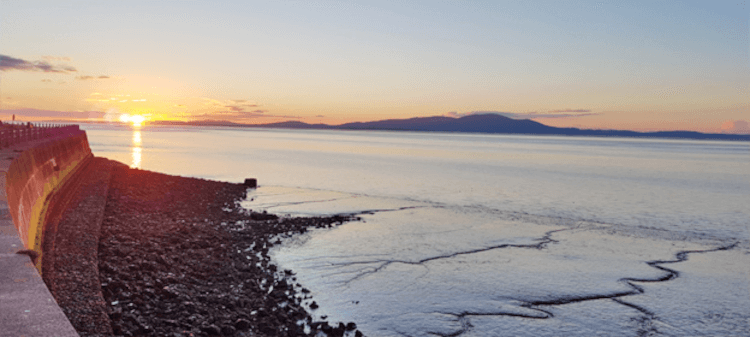 The view at sunset from Silloth's sea walls and out across the water to Scotland.