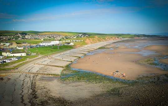 Walking holidays through St Bees include this Cumbrian beach, with sand and cafes in view