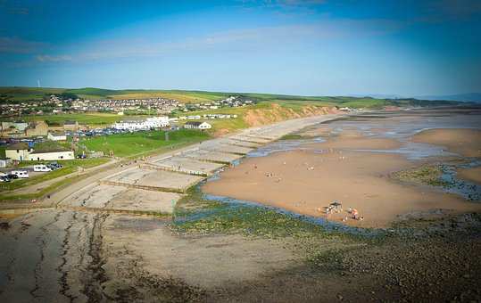 Walking holidays through St Bees include this Cumbrian beach, with sand and cafes in view