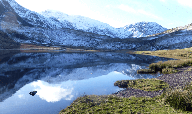 A snowy Lakeland peak over Styhead Tarn.