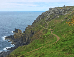 The South West Coast Path is especially challenging for anyone with vertigo, especially on narrow paths like this one, which curves along the ragged coastline toward the Botallack Mines.