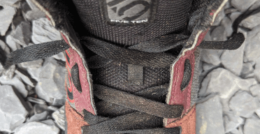 A Five-Ten mountain biking shoe displaying external gap lacing.