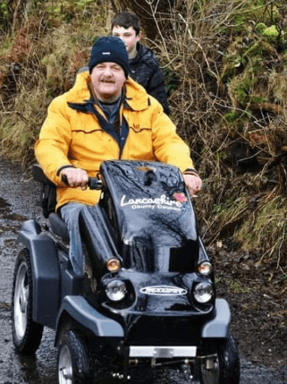 Riding a Tramper mobility scooter.