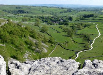 Views over vibrant green springtime countryside.