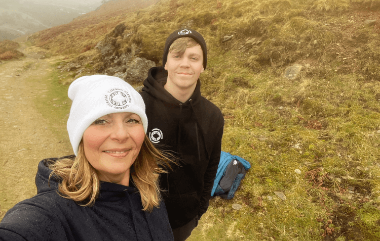 A mother and son walk together in the Lake District.