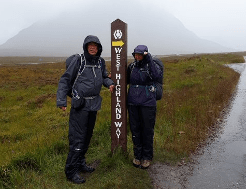 Inclement weather strikes a pair of walkers on the West Highland Way.