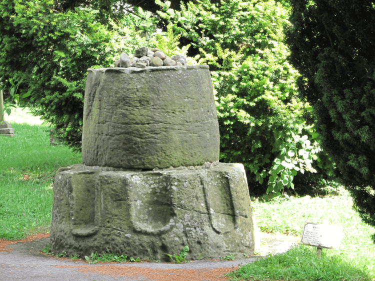 The Weeping Cross, carved from stone, with niches at the bottom.