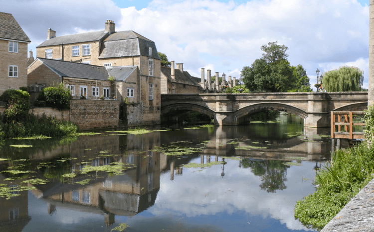 River Welland at Stamford by Connchadh H. Beautiful stone architecture reflects in the clear water of the River Welland beneath a three-arched bridge.