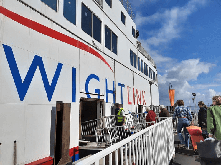 The Wight Link ferry moored and taking on passengers.