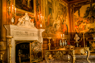 Windsor Castle by llee_wu. The grand interior of Windsor Castle, including an enormous fireplace and enormous paintings in gilt picture frames.