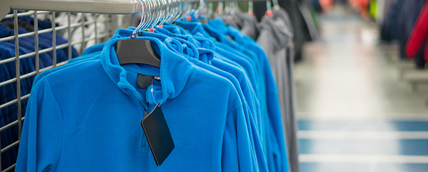 A rack of fleeces in an outdoor supply shop. These are the ideal mid-layers to wear when you're walking.