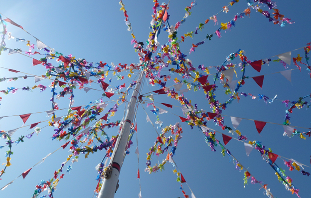 May Day maypole against a blue sky in Padstow